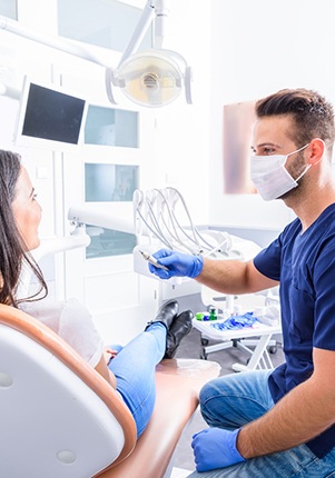 Dentist and patient talking in dental office