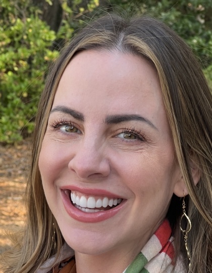 Woman with flawless smile after porecelain veneer treatment